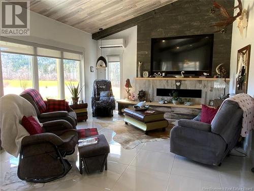 134 Titus Road, Edmundston, NB - Indoor Photo Showing Living Room With Fireplace