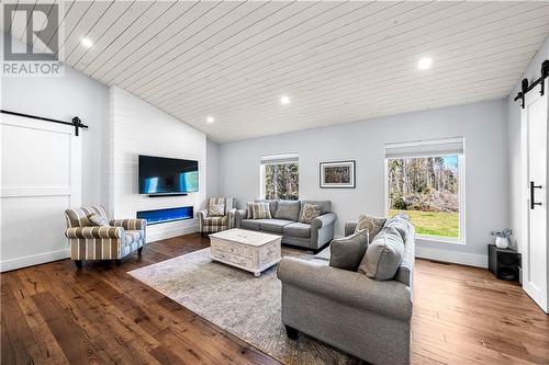 25 Roma Helene Road, Grand-Barachois, NB - Indoor Photo Showing Living Room With Fireplace