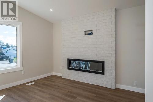 235 N Lyon Street, Prince George, BC - Indoor Photo Showing Living Room With Fireplace