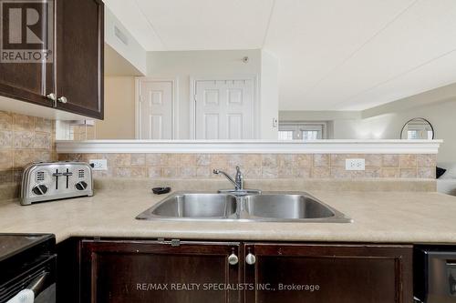 104 - 1483 Maple Avenue, Milton, ON - Indoor Photo Showing Kitchen With Double Sink