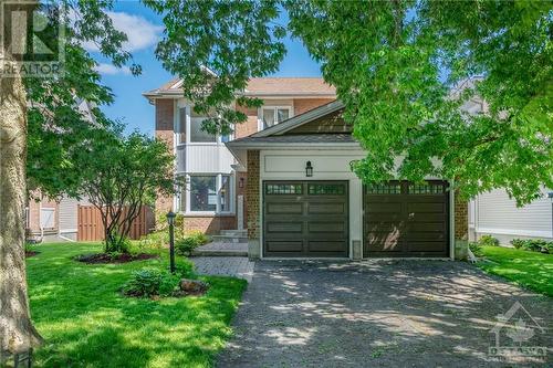 Mature trees welcome you to a long laneway with ample parking. - 22 Fernbrook Place, Kanata, ON - Outdoor