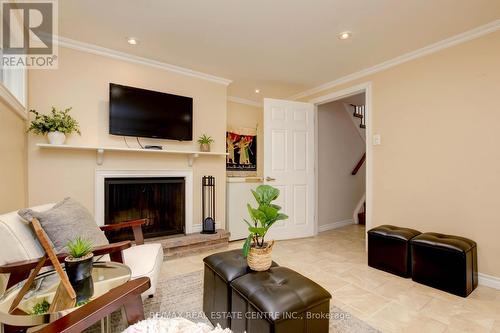 4 - 2145 Sherobee Road, Mississauga, ON - Indoor Photo Showing Living Room With Fireplace