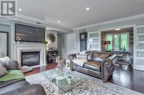 306 - 390 Upper Middle Road E, Oakville, ON - Indoor Photo Showing Living Room With Fireplace