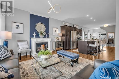 703 Hampton Circle, Saskatoon, SK - Indoor Photo Showing Living Room With Fireplace