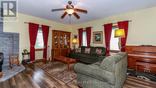 1743 Golf Course Road, Springwater, ON - Indoor Photo Showing Living Room With Fireplace