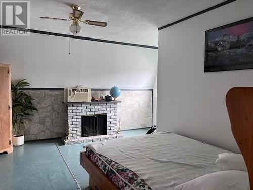 10522 Highway 64, West Nipissing, ON - Indoor Photo Showing Bedroom With Fireplace