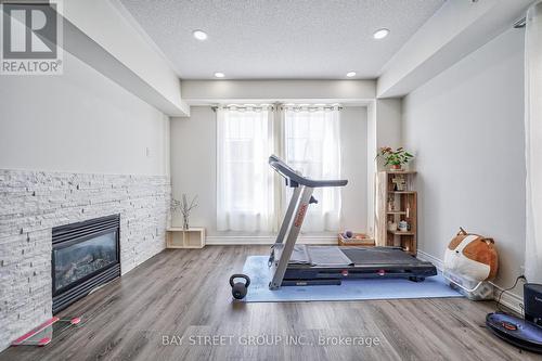 54 Cathedral High Street, Markham, ON - Indoor Photo Showing Gym Room With Fireplace