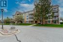 102 - 50 Rivermill Boulevard, Kawartha Lakes, ON  - Outdoor With Balcony With Facade 
