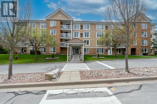 102 - 50 Rivermill Boulevard, Kawartha Lakes, ON - Outdoor With Balcony With Facade
