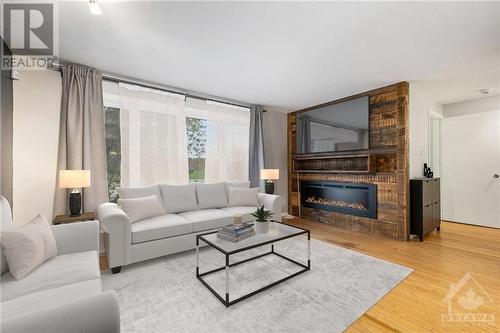 2373 Walkley Road, Ottawa, ON - Indoor Photo Showing Living Room With Fireplace