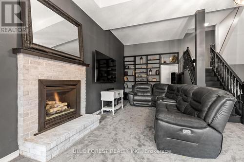 4 Woodland Road, Central Elgin, ON - Indoor Photo Showing Living Room With Fireplace