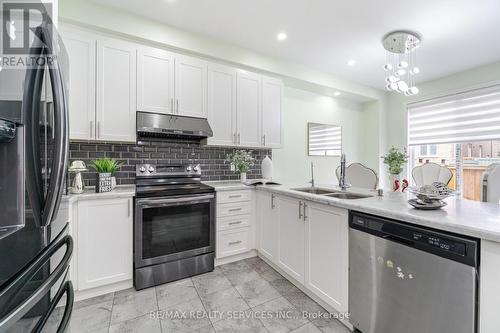 24 Spokanne Street N, Brampton, ON - Indoor Photo Showing Kitchen With Double Sink