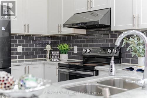24 Spokanne Street N, Brampton, ON - Indoor Photo Showing Kitchen With Double Sink