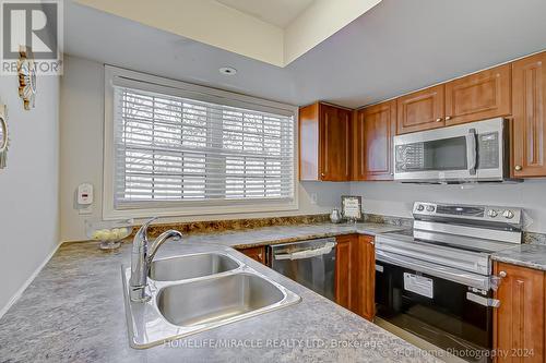109 - 37 Four Winds Drive, Toronto, ON - Indoor Photo Showing Kitchen With Double Sink