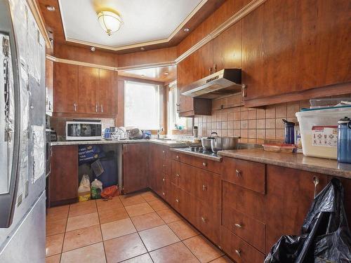 Cuisine - 12720 54E Avenue (R.-D.-P.), Montréal (Rivière-Des-Prairies/Pointe-Aux-Trembles), QC - Indoor Photo Showing Kitchen With Double Sink