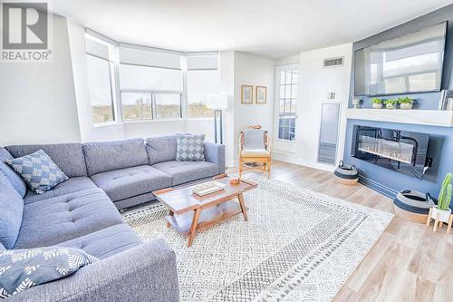 1411 - 3845 Lake Shore Boulevard, Toronto, ON - Indoor Photo Showing Living Room With Fireplace