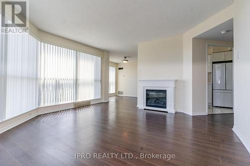 610 - 2177 Burnhamthorpe Road W, Mississauga, ON - Indoor Photo Showing Living Room With Fireplace