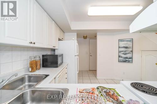 215 - 1881 Mcnicoll Avenue, Toronto, ON - Indoor Photo Showing Kitchen With Double Sink