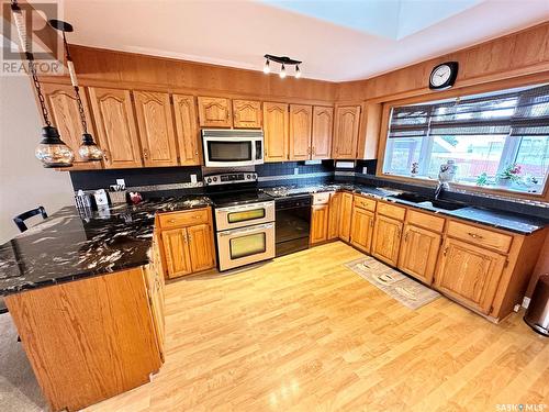 28 Hartney Bay, Weyburn, SK - Indoor Photo Showing Kitchen With Double Sink