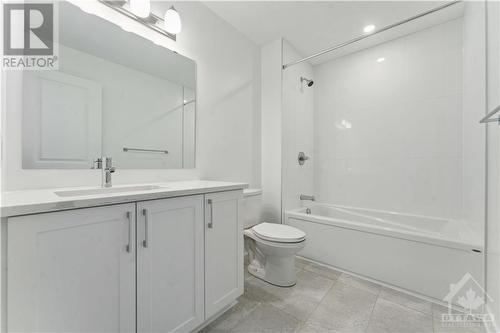 Main bathroom with upgraded tile and quartz counters - 314 Makobe Lane, Ottawa, ON - Indoor Photo Showing Bathroom