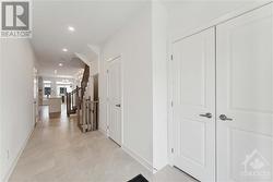 Foyer with large closet with swing doors - 