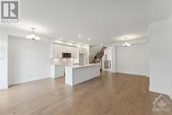 Hardweood flooring throught and seemlessly runs in to kitchen - 