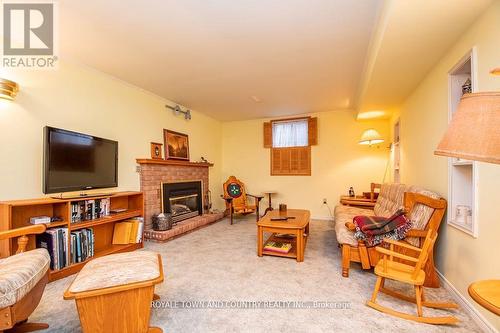 18 Corneil Street, Kawartha Lakes, ON - Indoor Photo Showing Living Room With Fireplace