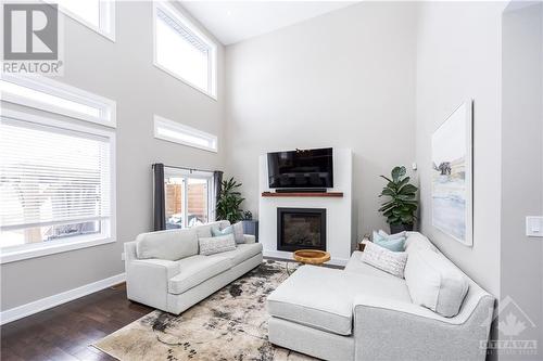 1613 Magic Morning Way, Greely, ON - Indoor Photo Showing Living Room With Fireplace