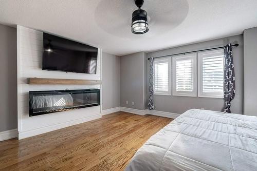 79 Kaufman Drive, Binbrook, ON - Indoor Photo Showing Bedroom With Fireplace