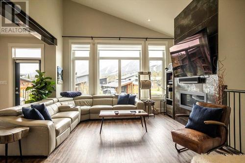 7 Single Track Way, Fernie, BC - Indoor Photo Showing Living Room With Fireplace