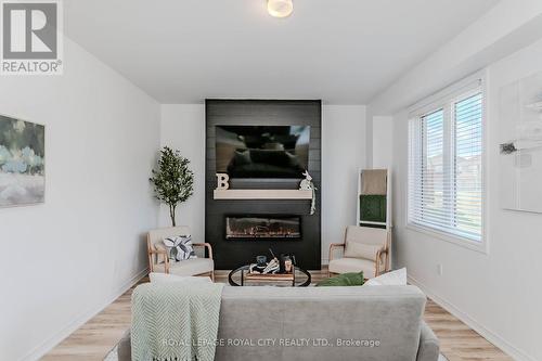 79 Elliot Avenue W, Centre Wellington, ON - Indoor Photo Showing Other Room With Fireplace