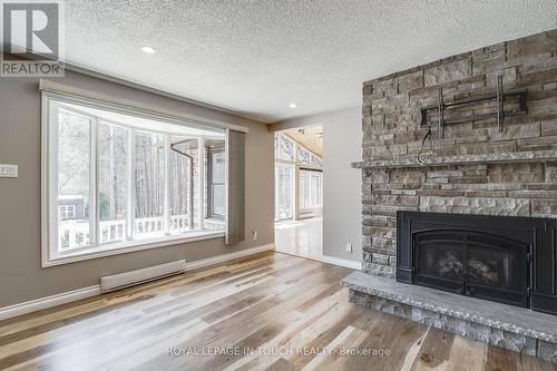 61 Beaufort Crescent, Tiny, ON - Indoor Photo Showing Living Room With Fireplace