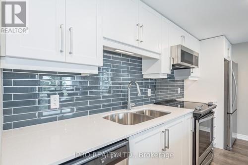 #211 - 104 Summit Ridge Drive, Guelph, ON - Indoor Photo Showing Kitchen With Stainless Steel Kitchen With Double Sink With Upgraded Kitchen