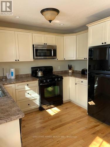 111-8 - 1052 Rat Bay Road, Lake Of Bays, ON - Indoor Photo Showing Kitchen With Double Sink