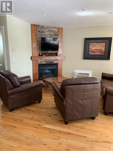 111-8 - 1052 Rat Bay Road, Lake Of Bays, ON - Indoor Photo Showing Living Room With Fireplace