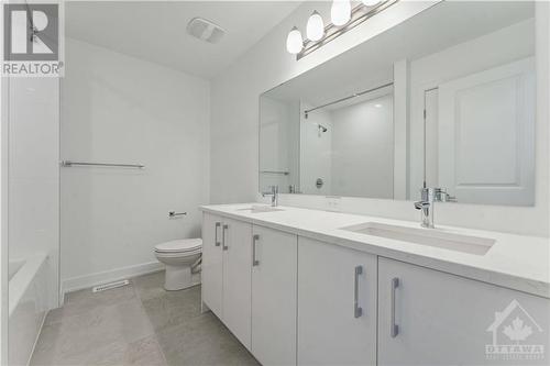 Quartz counters in main bathroom and sleek modern fixtures - 316 Makobe Lane, Ottawa, ON - Indoor Photo Showing Bathroom