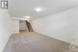 Stairs lead into the spacious finished basement - 