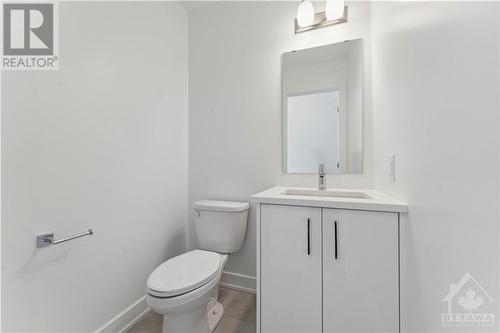 Powder room with quartz counters - 316 Makobe Lane, Ottawa, ON - Indoor Photo Showing Bathroom
