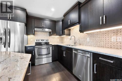 254 4002 Sandhill Crescent, Regina, SK - Indoor Photo Showing Kitchen With Stainless Steel Kitchen With Upgraded Kitchen