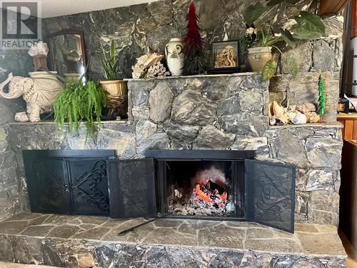 239 Stepping Stone Crescent, Spallumcheen, BC - Indoor Photo Showing Living Room With Fireplace