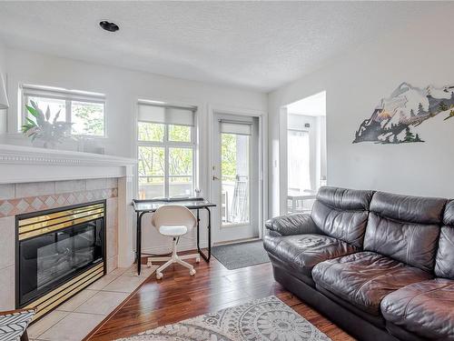 304-1580 Christmas Ave, Saanich, BC - Indoor Photo Showing Living Room With Fireplace