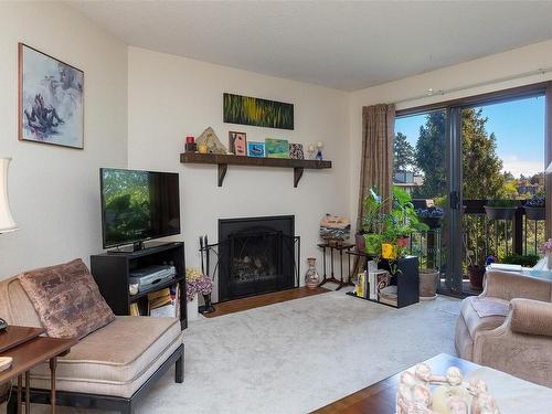 405-75 Gorge Rd West, Saanich, BC - Indoor Photo Showing Living Room With Fireplace