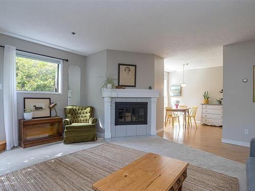 101-1252 Pandora Ave, Victoria, BC - Indoor Photo Showing Living Room With Fireplace