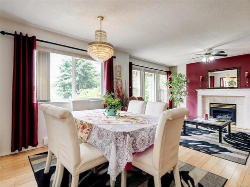 1187 Gait Lane, Saanich, BC - Indoor Photo Showing Dining Room With Fireplace