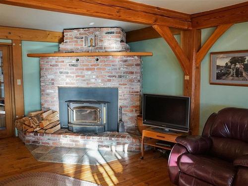 969 Whaletown Rd, Cortes Island, BC - Indoor Photo Showing Living Room With Fireplace