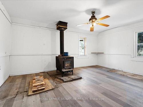 10 West Park Lane, Addington Highlands, ON - Indoor Photo Showing Other Room With Fireplace