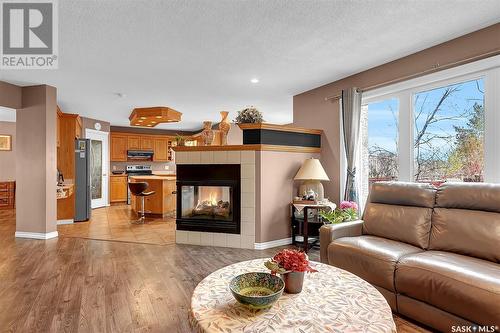 11195 Wascana Meadows, Regina, SK - Indoor Photo Showing Living Room With Fireplace