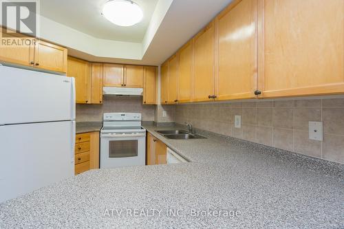 1730 - 3888 Duke Of York Boulevard, Mississauga, ON - Indoor Photo Showing Kitchen With Double Sink