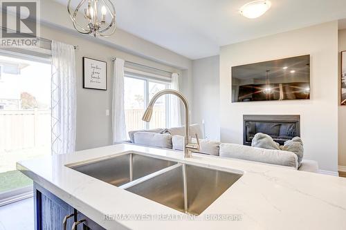 41 Starling Drive, Hamilton, ON - Indoor Photo Showing Kitchen With Fireplace With Double Sink