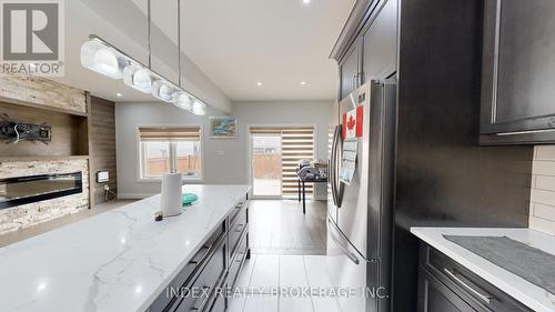 2431 Daisy Bend, London, ON - Indoor Photo Showing Kitchen With Fireplace